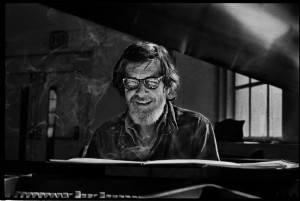 John Cage at a piano